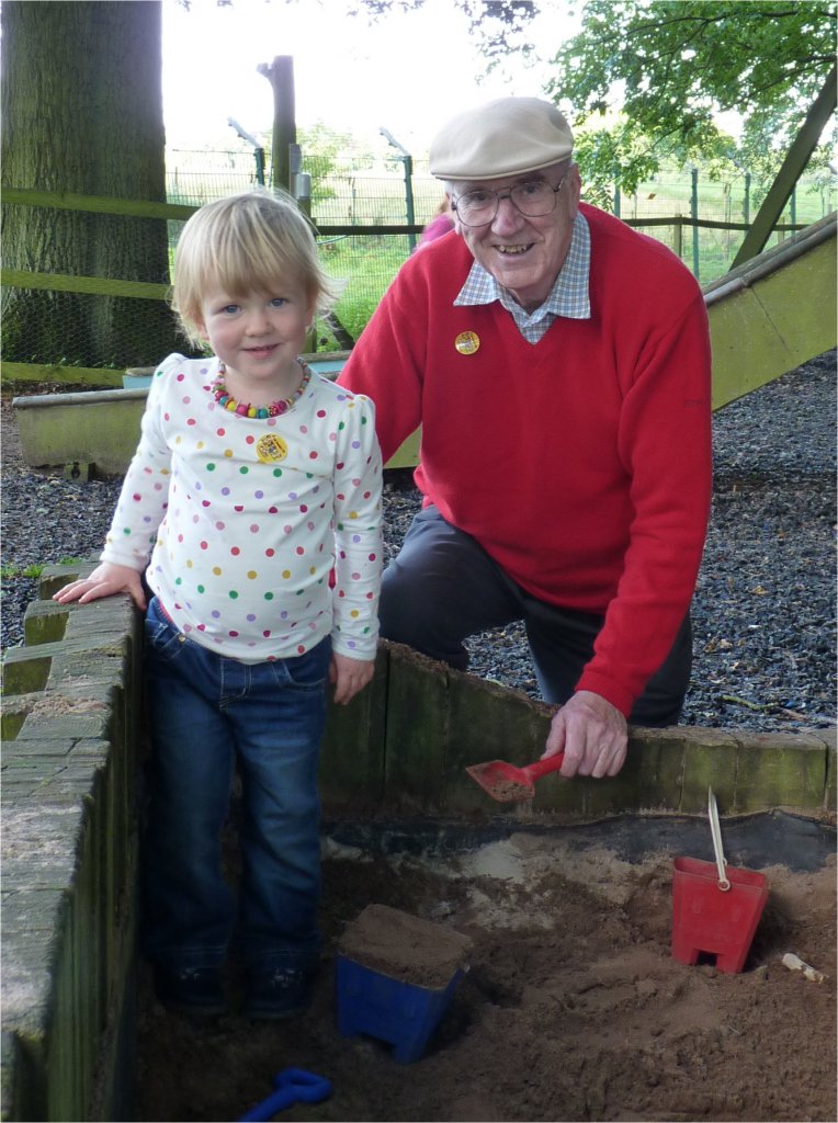 Christine and Grandda Burnett, in the sand-pit, 2012